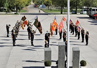 Vista aérea de Los guiones y banderines de la unidades de la UME en la Base Aérea de Torrejón formadod para el Acto de Homenaje a los Caidos