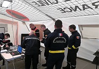 Una vez pasado por el Centro de Recepción y Salida (RDC), reunión en la Célula de Coodinación USAR (UCC) del Centro de Coordinación de Operaciones en el Sitio (OSOCC)